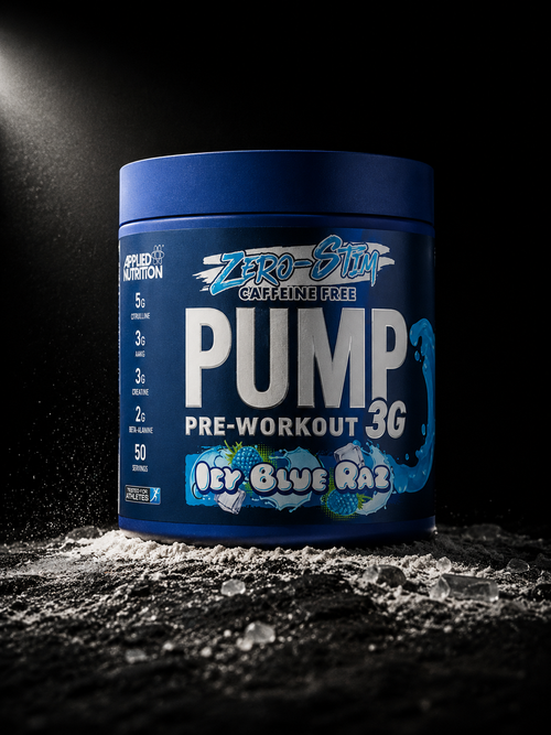 Applied Nutrition Pump 3G Zero Stim pre-workout tub photographed on dark volcanic stone with scattered pre-workout ingredient particles in cinematic studio lighting.